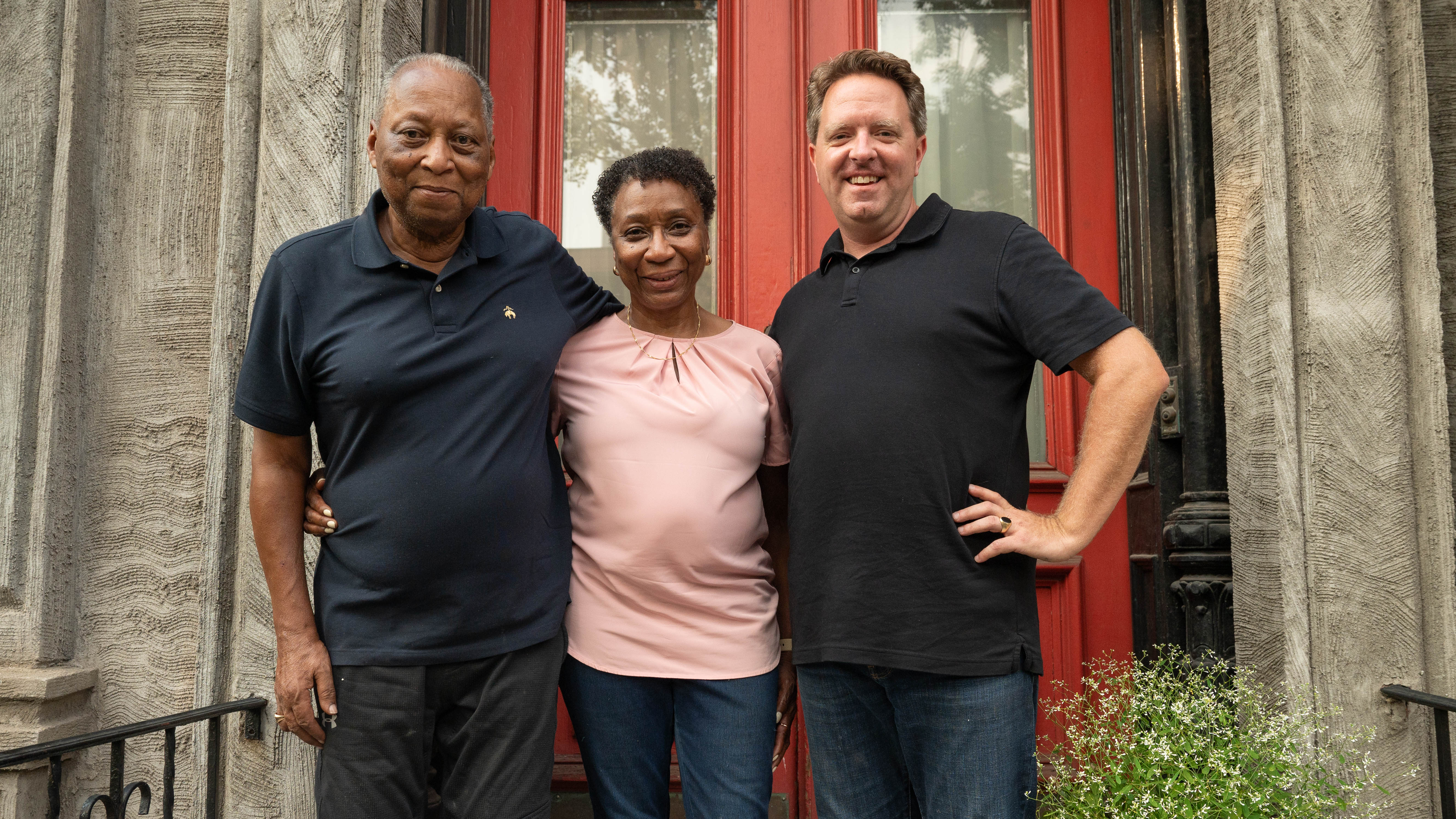 Richard and Ann, longtime Brooklyn residents, in front of their brownstone with Matt. Courtesy of VPM.